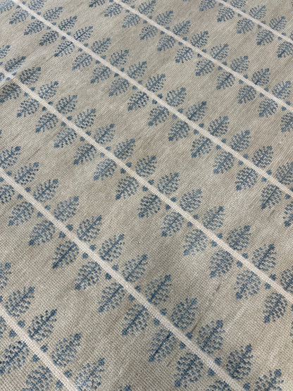 Close-up of Bea Modern Oushak rug showing warm gray, cream, gray-blue, hand-knotted wool