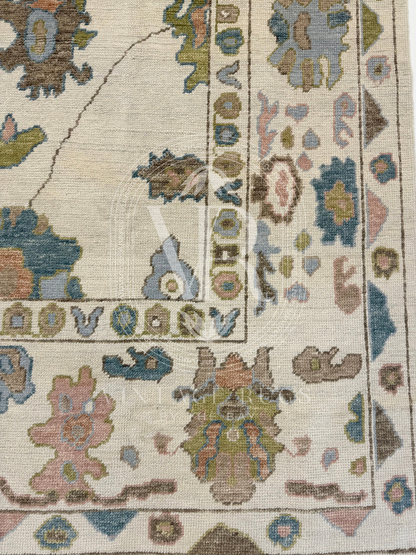 close up of Hand-knotted Palmer Turkish Oushak rug with a soft neutral base and matching neutral border colorful accents featuring turquoise, salmon, chartreuse, light blue, and warm brown accents in a modern, colorful pattern—perfect for living rooms, bedrooms, nurseries, and dining spaces.