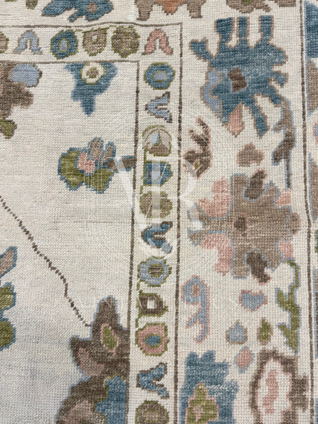 Hand-knotted Palmer Turkish Oushak rug with a soft neutral base and matching neutral border colorful accents featuring turquoise, salmon, chartreuse, light blue, and warm brown accents in a modern, colorful pattern—perfect for living rooms, bedrooms, nurseries, and dining spaces.