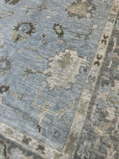 Josephine Turkish Oushak rug, light blue with slate gray border and chocolate brown, green, tan, and cream tones