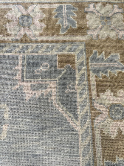 Susie gray-blue and brown modern Oushak rug with sage green, tan, and cool gray accents, hand-knotted wool
