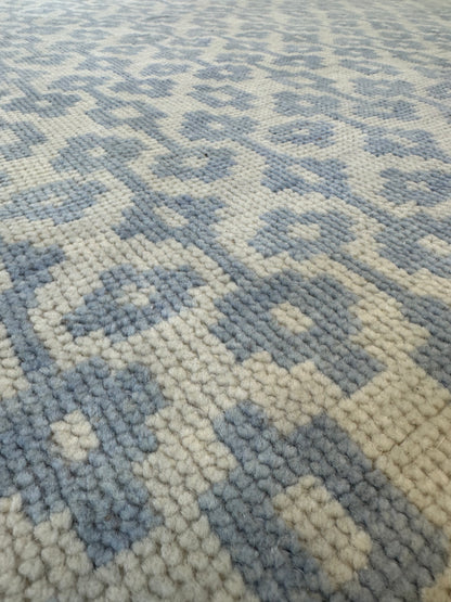 Ella Blue Modern Oushak rug styled in a room, light blue, hand-knotted wool