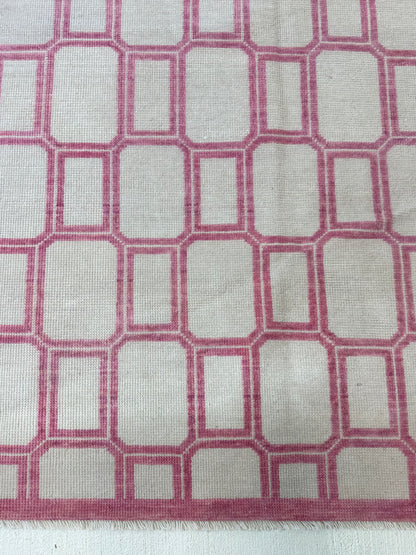 Macie modern Oushak rug, an ivory foundation and lively magenta accents