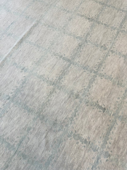 Claire Modern Oushak rug styled in a room, warm gray, sea foam, hand-knotted wool
