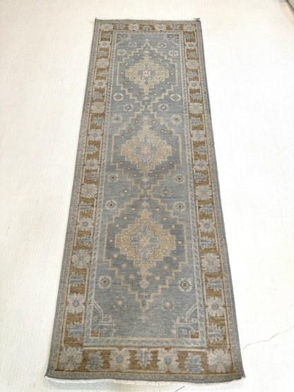 Susie gray-blue and brown modern Oushak rug with sage green, tan, and cool gray accents, hand-knotted wool
