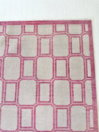 Macie modern Oushak rug, hand-knotted wool with an ivory foundation and lively magenta accents