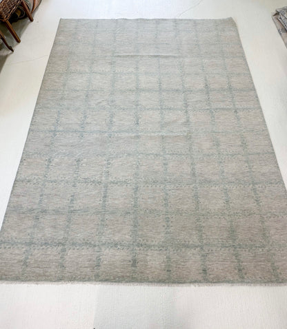 Close-up of Claire Modern Oushak rug showing warm gray, sea foam, hand-knotted wool