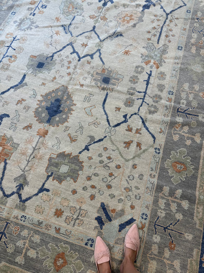 Sophia Turkish Oushak rug, hand-knotted wool with an ivory base, gray border, and orange, cobalt, light green, light blue, and tan accents