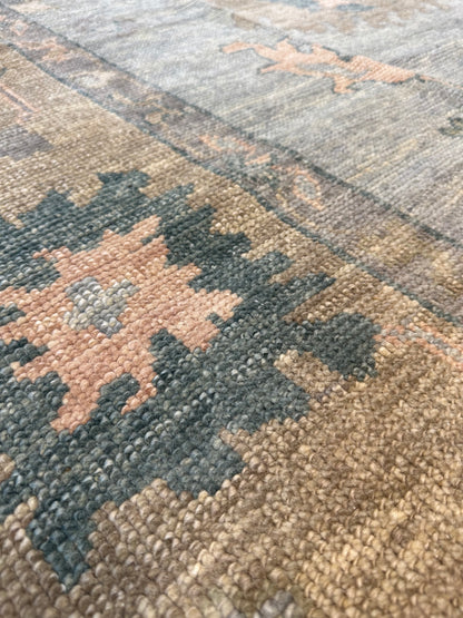 Juliet light blue Turkish Oushak rug with a tan border and pink, teal, and blue accents, hand-knotted wool