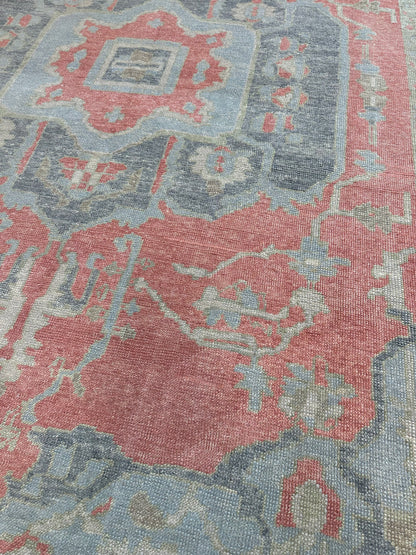 Ruby raspberry red Turkish Oushak rug with navy, light blue, light green, tan, and cream accents, hand-knotted wool
