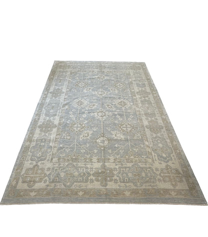 Close-up of Dorothy Turkish Oushak rug showing gray-blue, cream, warm tan, light brown, hand-knotted wool