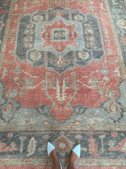 Ruby hand-knotted wool Turkish Oushak rug in raspberry red with navy, light blue, and green tones