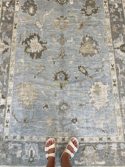 Josephine light blue Turkish Oushak rug with a slate gray border and brown, green, tan, and cream accents, hand-knotted wool