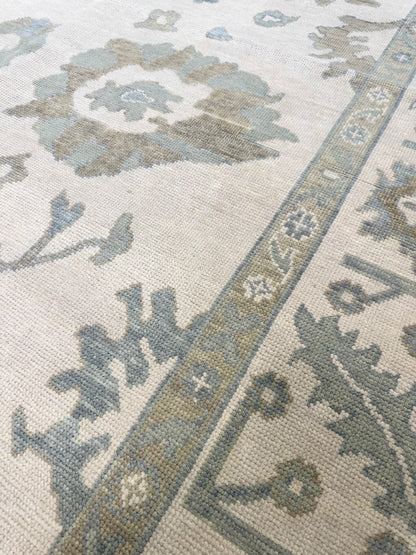 Emily Modern Oushak rug styled in a room, cream, soft gray, blue, gray-green, warm tan, hand-knotted wool