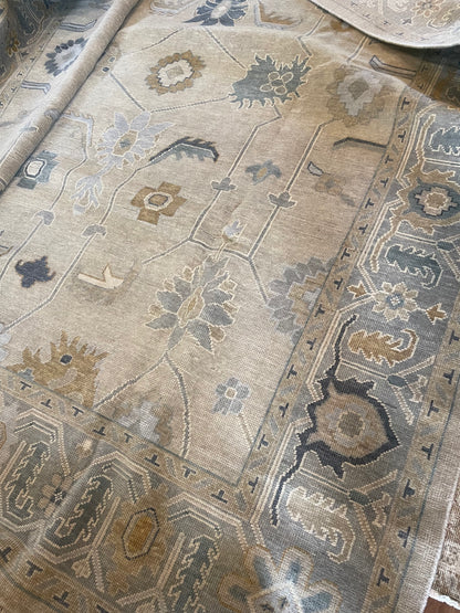 Close up of neutral oushak rug