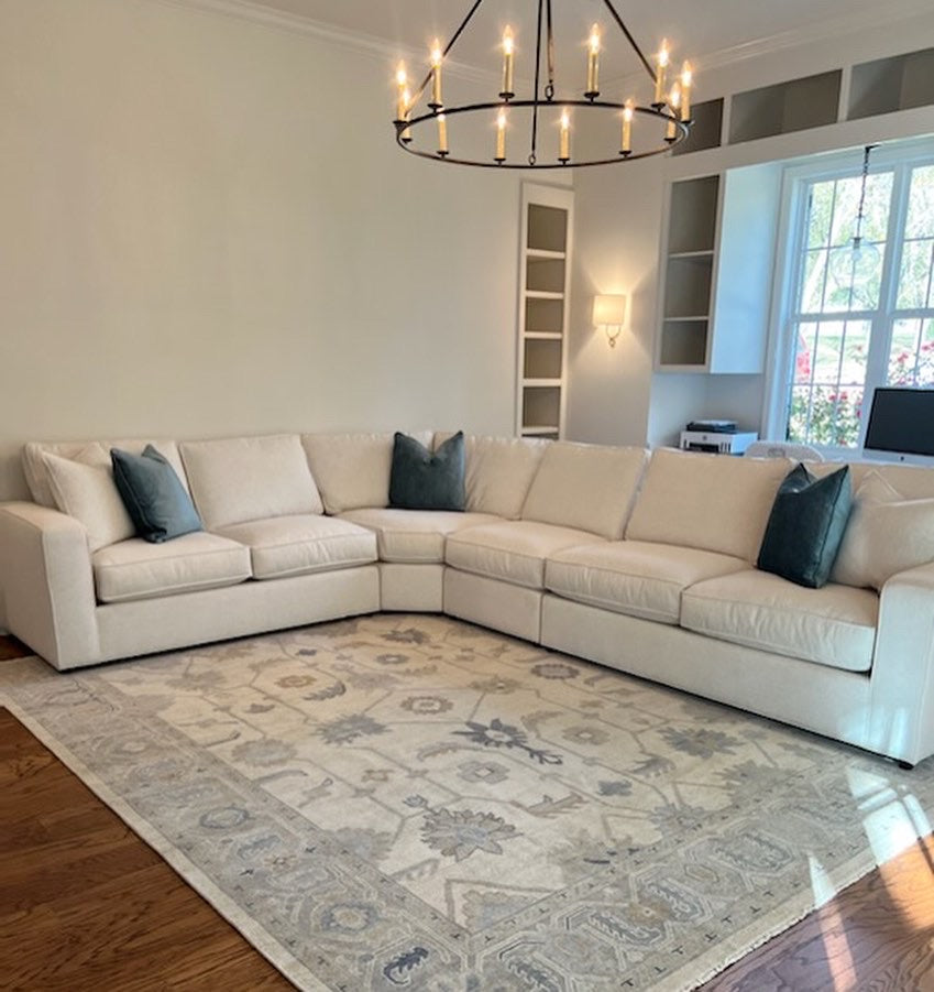 Cream Modern Oushak rug in living room