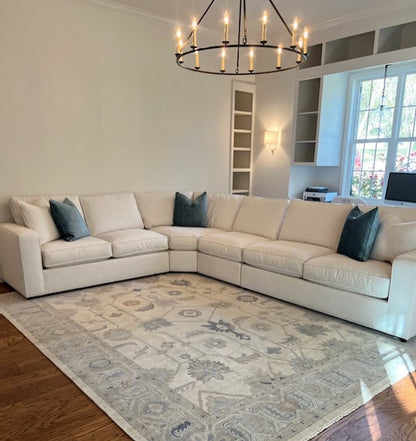 Cream Modern Oushak rug in living room