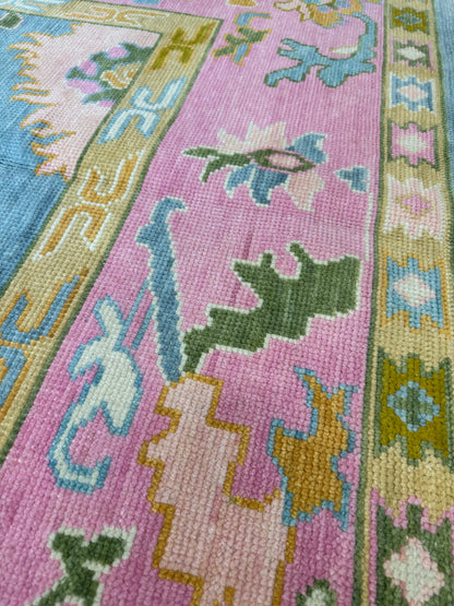 Addie Modern Oushak rug, medium blue, pink border, green, orange, tan, cream, chartreuse-olive, hand-knotted wool — alternate view