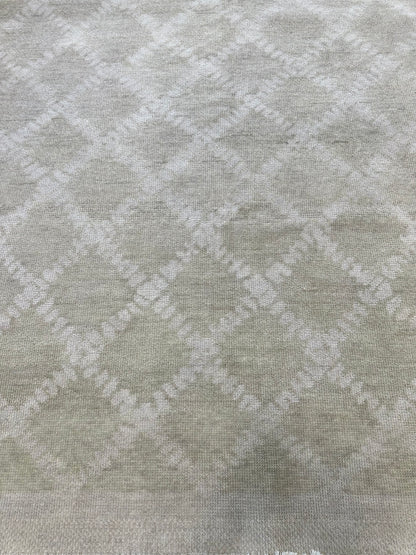 Close-up of Anne Modern Oushak rug showing warm gray, very light gray, hand-knotted wool