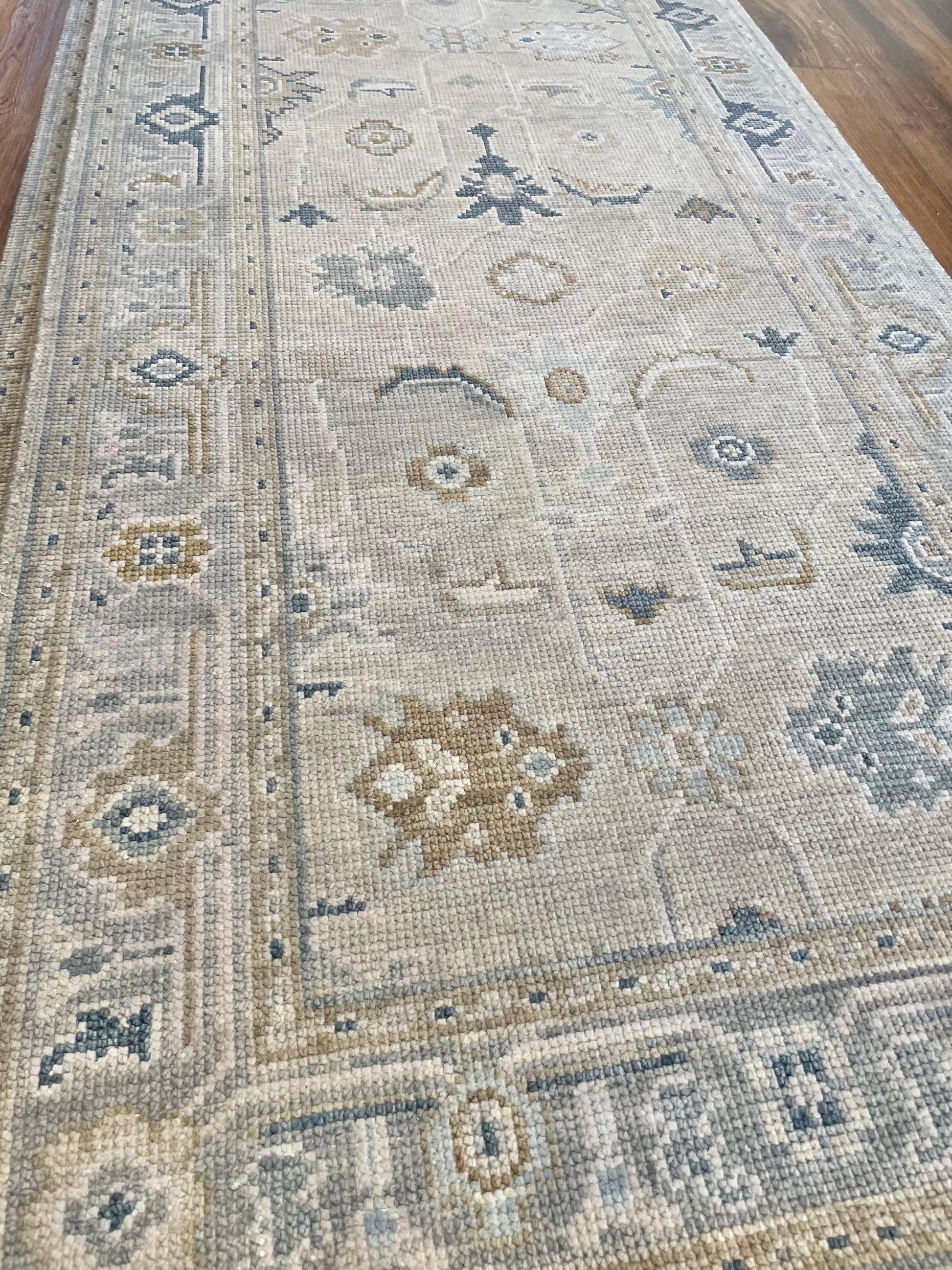 Emerson modern oushak rug detail view — soft beige and blue hand-knotted wool, heirloom area rug available in custom sizes