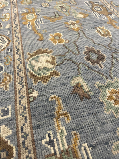 Mae modern Oushak rug, hand-knotted wool with a blue-gray foundation and cream, mustard, sage, and brown accents