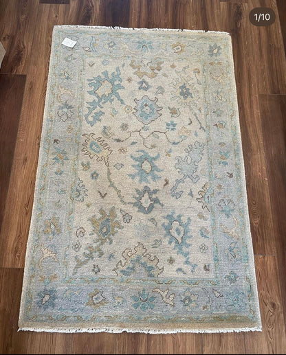 Maggie hand-knotted wool modern Oushak rug in a warm gray foundation, cool gray border, and aqua and turquoise accents