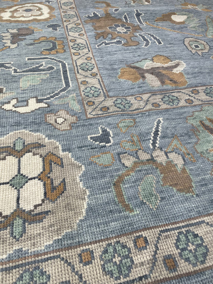 Mae modern Oushak rug with a blue-gray foundation and cream, mustard, sage, and brown accents, hand-knotted wool