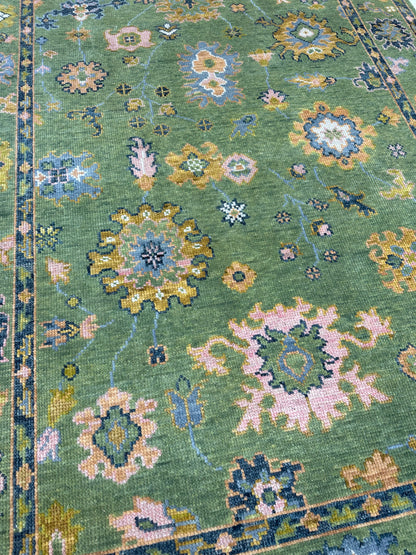 Linda hand-knotted wool modern Oushak rug in a lime green foundation and slate blue, pink, chartreuse, cream, and orange accents