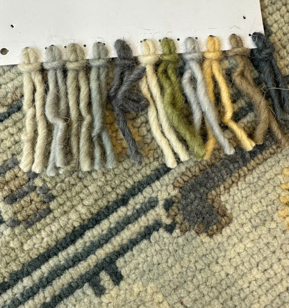 Margot modern Oushak rug, a gray center, light blue border, and mustard, green, cream, and navy accents