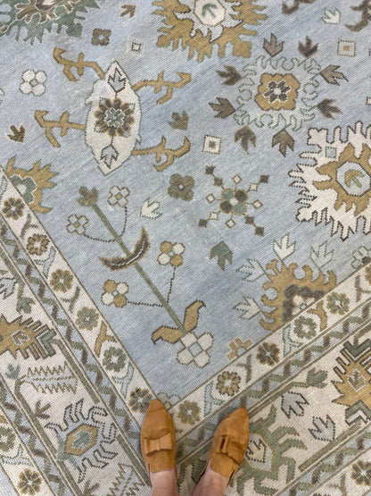 Katherine modern Oushak rug, hand-knotted wool with a light blue base and cream, tan, ochre, and soft green accents