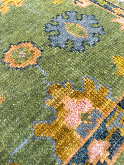 Linda modern Oushak rug with a lime green foundation and slate blue, pink, chartreuse, cream, and orange accents, hand-knotted wool