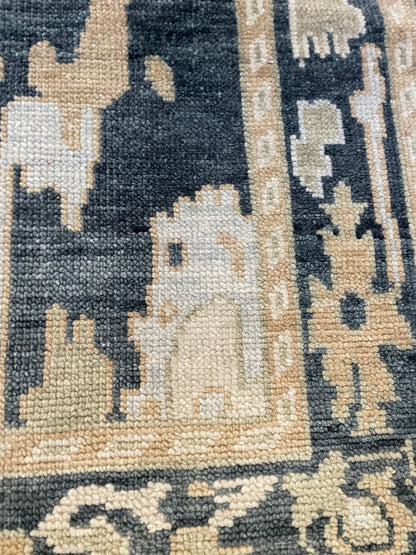 Close-up of Eloise Modern Oushak rug showing moody blue-green, cream, olive, light blue, tan, hand-knotted wool