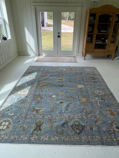 Mae hand-knotted wool modern Oushak rug in a blue-gray foundation and cream, mustard, sage, and brown accents