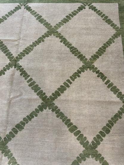 Lynn modern Oushak rug, a very light warm gray foundation and soft green accents
