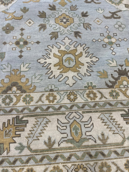 Katherine light blue modern Oushak rug with cream, tan, ochre, and soft green, hand-knotted wool