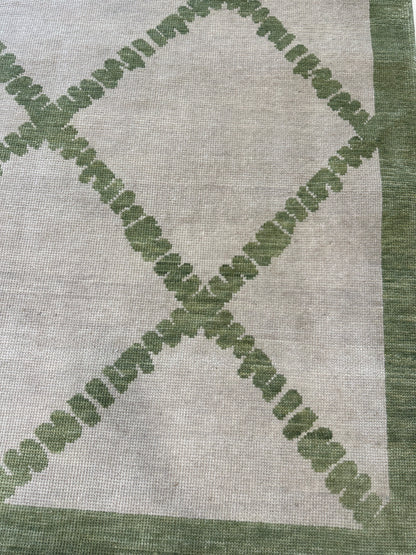 Lynn modern Oushak rug, hand-knotted wool with a very light warm gray foundation and soft green accents