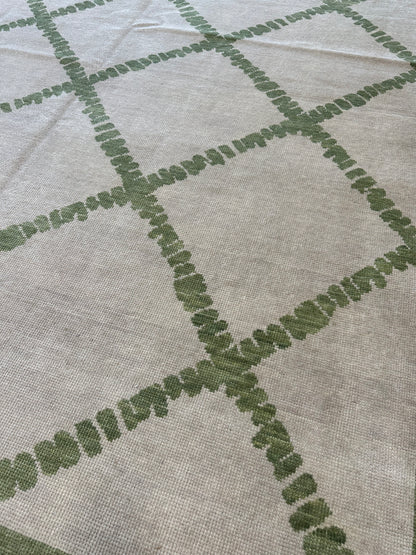 Lynn hand-knotted wool modern Oushak rug in a very light warm gray foundation and soft green accents