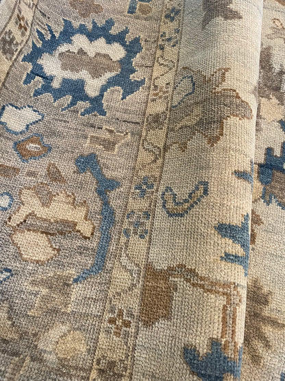 Ollie hand-knotted wool modern Oushak rug, cool gray foundation with taupe, cobalt blue, and tan tones