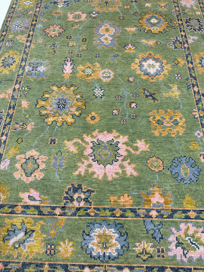 Linda hand-knotted wool modern Oushak rug in a lime green foundation and slate blue, pink, chartreuse, cream, and orange accents
