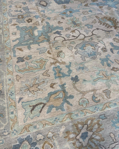 Maggie modern Oushak rug with a warm gray foundation, cool gray border, and aqua and turquoise accents, hand-knotted wool