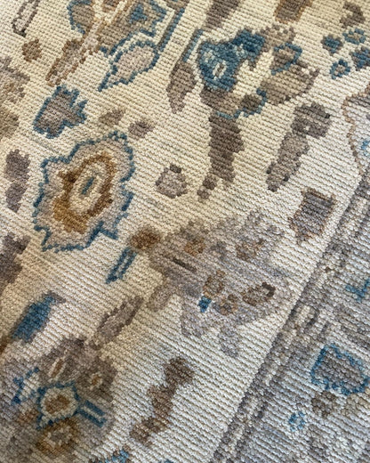 Ollie cool gray and taupe modern Oushak rug with cobalt blue, tan, and cream accents, hand-knotted wool