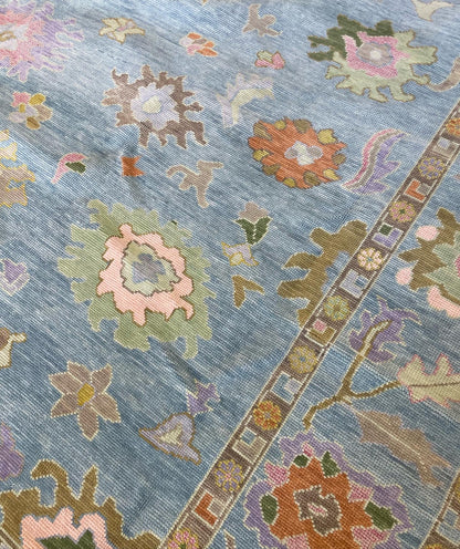 Gracie Modern Oushak rug close-up, blue-green, orange, pink, purple, green, tans, hand-knotted 100% wool