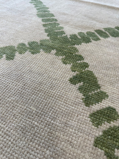 Lynn modern Oushak rug with a very light warm gray foundation and soft green accents, hand-knotted wool